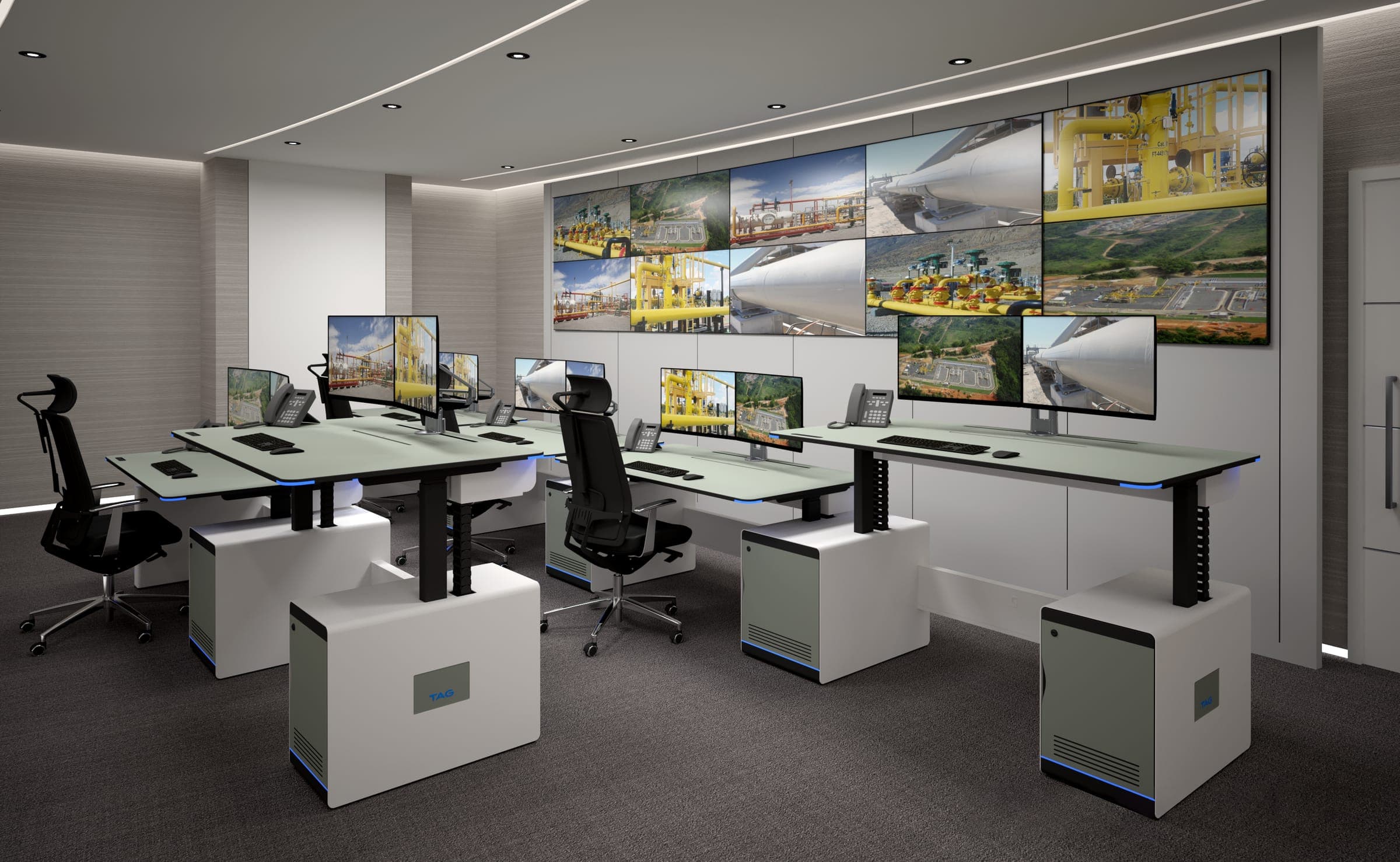 Elite AIR sit-stand consoles, custom control room furniture, with dual monitors facing a transit operations video wall